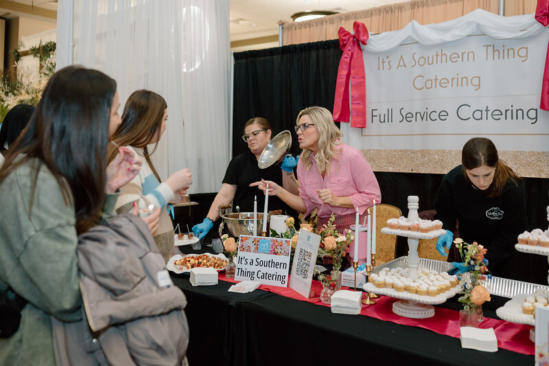 Guests sampling desserts at a catering table